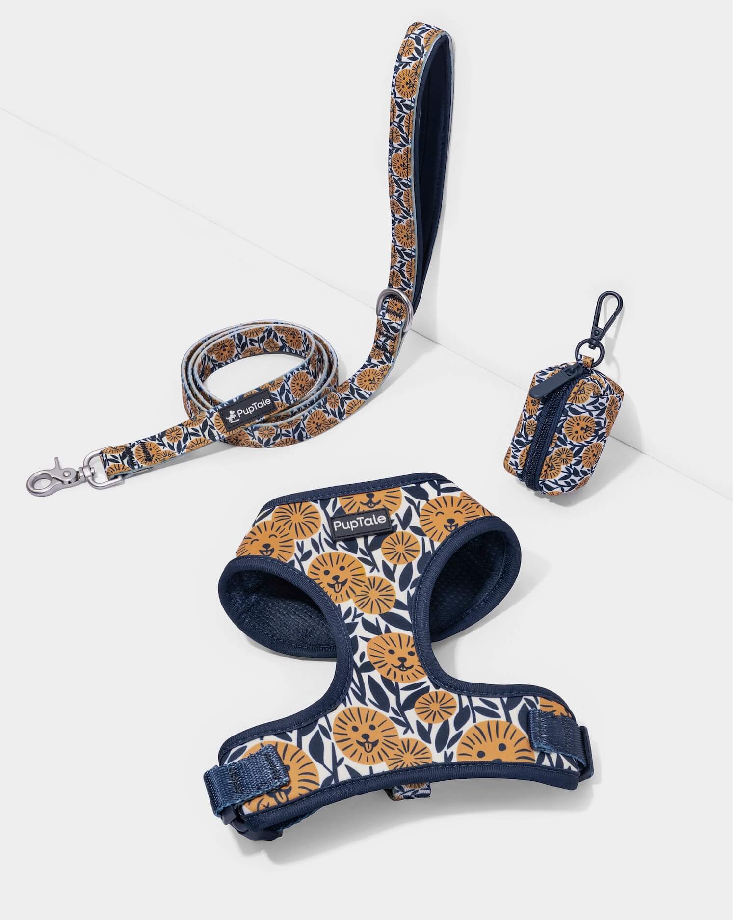 A dog harness and leash set with a blue and yellow sunflower pattern, including a matching leash with padded handle and zinc alloy hook.