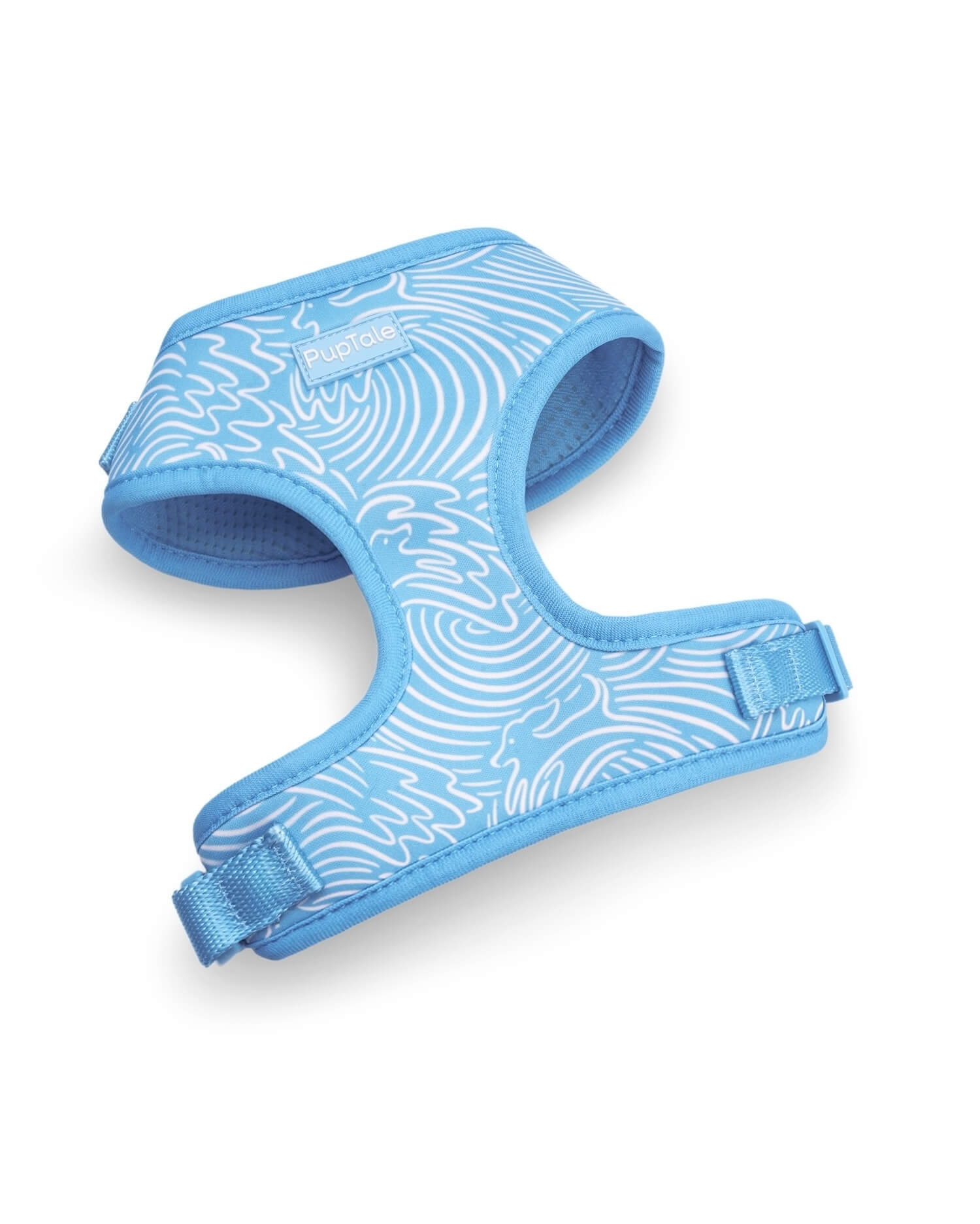 Blue adjustable dog harness with a wave pattern design.