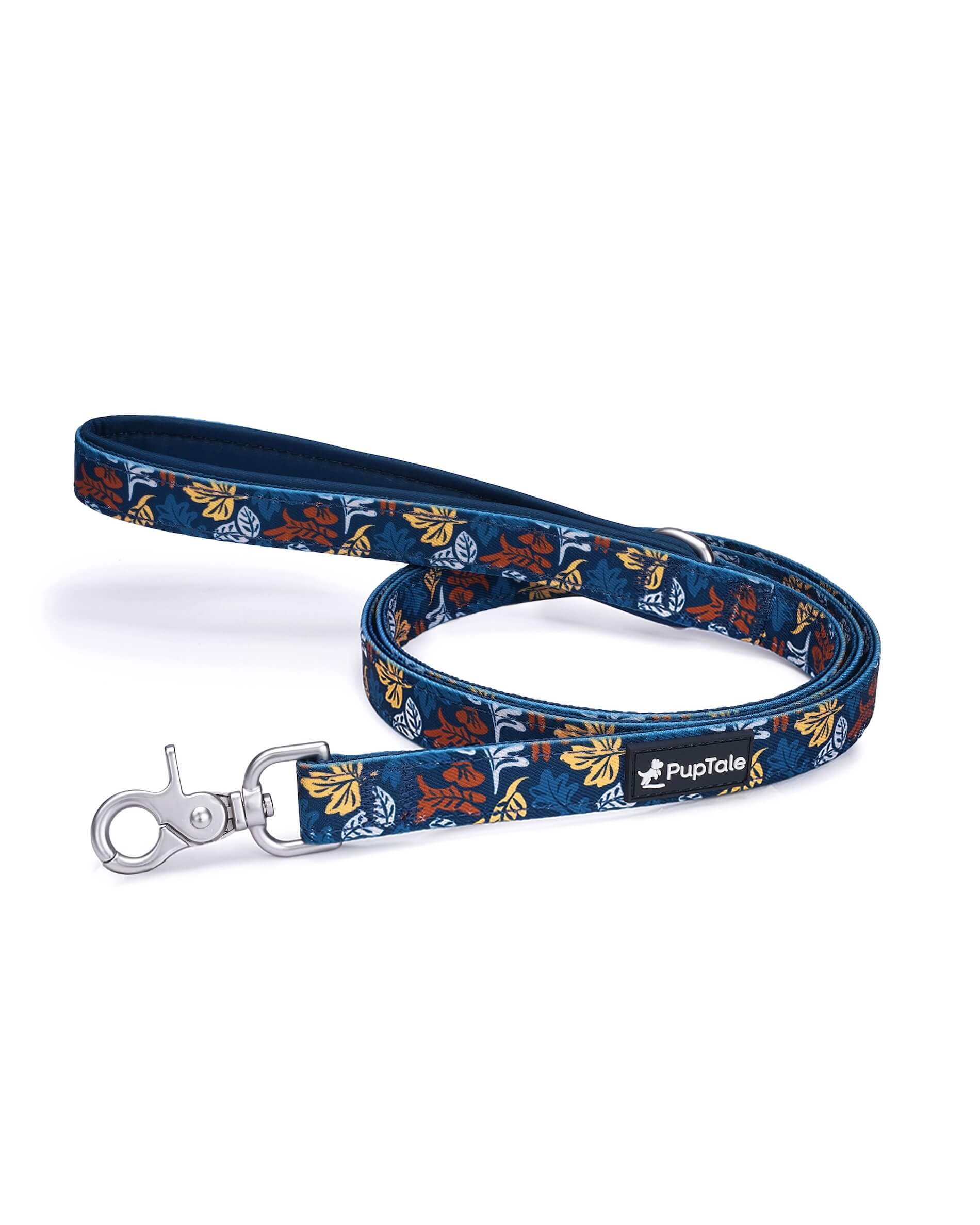 A blue dog leash with amber colored leaf patterns and a padded handle.